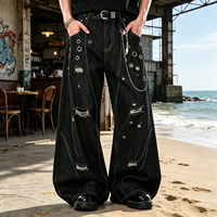 Jean baggy noir délavé et déchiré avec logo personnalisé, œillets et chaînes, coupe large, style punk streetwear pour homme