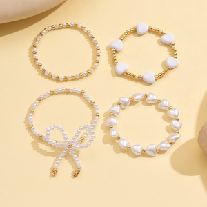 European and American cross-border elegant and versatile heart-shaped faux pearl <b>bracelet</b> four-piece <b>set</b> with bow stacking - Product Image 4