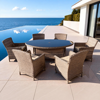Ensemble de salle à manger en rotin moderne 6 pièces Table ronde en verre Chaises rembourrées Style de couleur personnalisé pour patio Meubles d'extérieur résistants aux UV