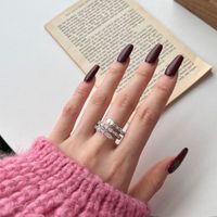 Nouveau Designer Bijoux De Mode Argent Twisted Spirit Serpent Os Forme Éternité Bande Baguette 5a Cubique Zircone Anneaux Fine Jewelry
