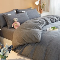 Ensemble minimaliste japonais de quatre pièces housse de couette simple en coton lavé drap de lit pour la maison