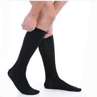 Repose-pieds de voyage Travel Comforts, chaussettes de sport de course Travelsky, chaussettes de football personnalisées, chaussettes de compression hautes pour hommes