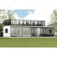 Cabine de pomme au deuxième étage avec terrasse maison conteneur avec escalier