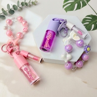 Coffret d'huiles à lèvres marque privée 2-en-1 : Huile à lèvres hydratante longue durée et imperméable aux fruits, avec bracelet porte-clés mignon