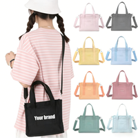 Sac à bandoulière portable en nylon léger et durable, taille moyenne, robuste et léger pour les trajets quotidiens