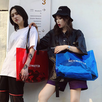 Sac fourre-tout transparent noir en PVC imperméable irisé avec poignée, en stock
