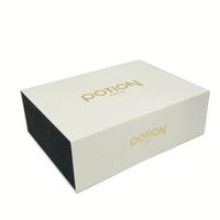 Boîte en carton de luxe en velours noir, forme de livre, fermeture magnétique, logo en feuille d'or, laminage mat, gaufrage, crème pour le visage
