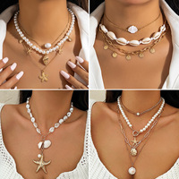 Collier vintage de plage en perles imitation or plaqué or BJA0514N avec étoile de mer et coquillage pour unisexe