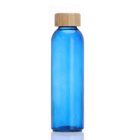 Bouteille d'eau portable pour la gym avec couvercle en bambou, vente en gros de bouteilles d'eau de sport en verre transparent