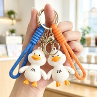 Llavero de silicona con diseño de pato blanco de dibujos animados, cuerda trenzada, colgante para mochila, regalo promocional, venta caliente de fábrica