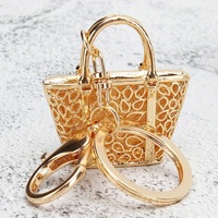 Nouveau porte-clés créatif en forme de petit sac léopard, pendentif de voiture exquis, cadeau pour femme