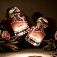 Flacon de parfum en verre rose rond épais de 50 ml, nouveau design, avec bouchon pompe transparent et boîte d'emballage cosmétique ronde verte, vente en gros