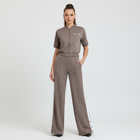 Ensemble de survêtement vintage années 90 personnalisé pour femme, avec haut zippé à bandes contrastantes et pantalon de survêtement à plis et boutons-pression, fabrication OEM