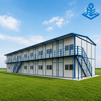 Bâtiment scolaire modulaire à deux étages, salle de classe préfabriquée avec revêtement en bois, maison préfabriquée de type T, dortoir communautaire