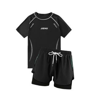 Jiehu Ensemble de maillots de bain pour hommes, haut à manches courtes à col rond à séchage rapide avec short pour la natation et les sources chaudes - Product Image 1