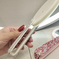 Vente en gros Nouveau miroir de maquillage rond de poche portable Miroir à main avec lumières LED