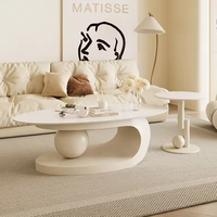 Table basse ovale en marbre et acier inoxydable durable, style crème simple et moderne, combinaison de meubles pour petite maison