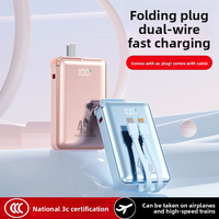 Batterie externe portable 2-en-1 pliable avec prise CA, charge rapide 45W, haute capacité Li-Polymère 20000mAh et câble intégré pour la vente en gros