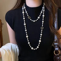 Collier long élégant à double rangs avec perles et fleurs noires ajourées, motif camélia, style français, bijou populaire, Collier De Camelia