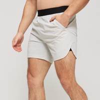Shorts de sport de course à pied personnalisés pour hommes Shorts en nylon et élasthanne à séchage rapide pour hommes Shorts de fitness avec logo brodé en silicone pour hommes