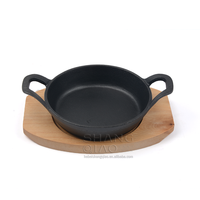 Vente de gros Plat à gratin rond en fonte Assiette Fajita avec socle en bois