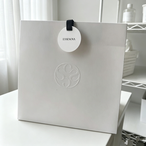 Essenova Luxury White Paper <b>Bag</b> With Embossed Logo Ribbon Handle Recyclable Cosmetic Packaging - Product Image 1