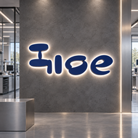 Lettres rétroéclairées en acier inoxydable bleu mat de précision avec halo blanc neutre, logo personnalisé pour l'entrée du laboratoire de robotique