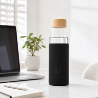 Bouteille d'eau en verre borosilicate de 500 ml avec manchon en silicone et logo en relief, couvercle en bambou – Meilleure vente
