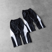 Conjunto Deportivo de 2 Piezas con Pantalones Desmontables, Chaqueta Cortavientos de Nailon Ligero y Transpirable con Diseño de Parches para Hombre