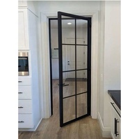 Porte double française en métal à 8 panneaux avec verre transparent de la collection Classic Grid, alliant charme et design industriel moderne