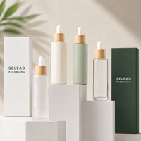 Vente en gros de flacons compte-gouttes en verre givré de 20 à 100 ml, couleur personnalisée, avec bouchon en bambou, pour sérum, huile essentielle, emballage cosmétique