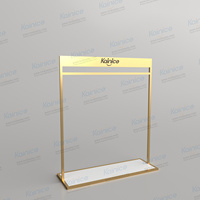 Kainice Porte-vêtements sur pied en acier inoxydable doré brillant personnalisé moderne Boutique de vêtements présentoirs pour robes
