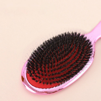 Brosse à cheveux à coussin d'air électrolytique avec poils de sanglier végétaliens démêlant la palette d'or rose pour un peigne droit bouclé We Dry