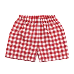 Ropa de verano para niños Fabricante Fábrica al por mayor Lino rojo con pantalones cortos a cuadros blancos para niña pequeña