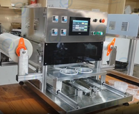 Machine à sceller entièrement automatique pour la conservation de l'air conditionné Machine pneumatique à sceller et à emballer à une sortie à quatre boîtes