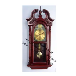 Tradizionale orologio da parete a pendolo in legno tondo Beige tradizionale orologio da parete rifinito in rovere dorato su impiallacciature di legno duro selezionate