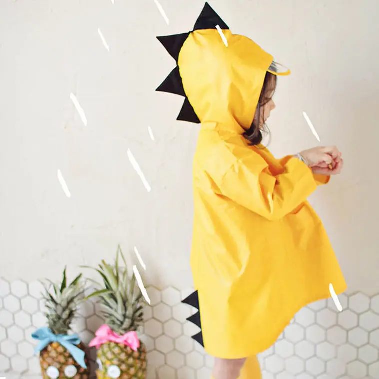 Venta caliente personalizado impermeable niños poliéster largo impermeable lindo dinosaurio forma con capucha impermeable para niños