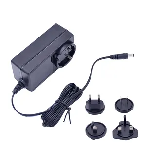 Versione a basso prezzo universale UK US EU AU Plug 12V 2A 24W dc adattatore da parete telefono da viaggio adattatore di alimentazione