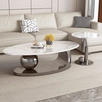 Table basse moderne de luxe en bois massif et marbre avec base artistique en acier inoxydable table centrale au design ovale unique pour le salon