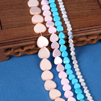 Vente en gros de coquillages naturels en forme d'amour avec des coquillages multicolores de haute qualité pour la production de bijoux