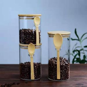 Pot de stockage en verre borosilicaté de forme ronde de diamètre 65mm 85mm 100mm avec couvercles et cuillère hermétiques en bambou pour céréales en grains de café - Product Image 3