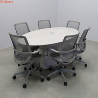Table élévatrice pour moniteur d'ordinateur de petite taille de forme ovale Table de conférence à surface solide Corian de conception moderne pour six personnes