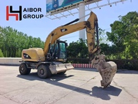 Excavatrice sur pneus d'occasion Caterpillar M315D M312 M317D2 en stock / Machine de terrassement sur roues Cat America originale à vendre
