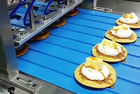 Ligne de production Dorayaki Il applique automatiquement le refroidissement Flips Dépôts Remplissage Timbres les produits et les sceaux et autres processus
