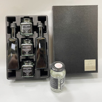 Boîtes cadeaux personnalisées en carton avec insert en pulpe moulée, couvercle et base, pour bouteilles d'huile d'olive, de miel, de caviar et de confiture.