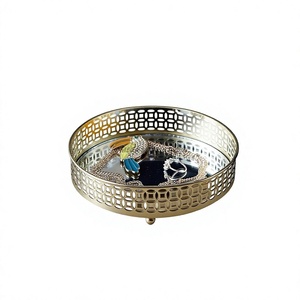 Elegant Round Gold Handmade Metal <b>Decorative</b> <b>Tray</b> with Intricate Cutout Design for Organizing Jewelry and Enhancing Home Decor - Product Image 1