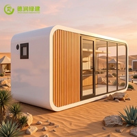 Maison-capsule spatiale de haute qualité avec coque en aluminium pour hôtel de camping dans le désert et logement modulaire préfabriqué moderne type Apple Cabin