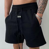 Shorts d'entraînement pour hommes, coupe ample, taille mi-haute, taille élastique avec poche latérale zippée, décontracté pour le style urbain et les tenues de sport
