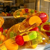 Nouveau jouet anti-stress en TPR souple en forme de banane à presser pour la rentrée scolaire/la remise des diplômes