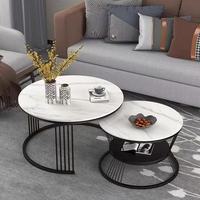 Table basse de style nordique avec plateau en dalle de roche luxueuse et structure en acier inoxydable, idéale pour salon moderne ou petit appartement